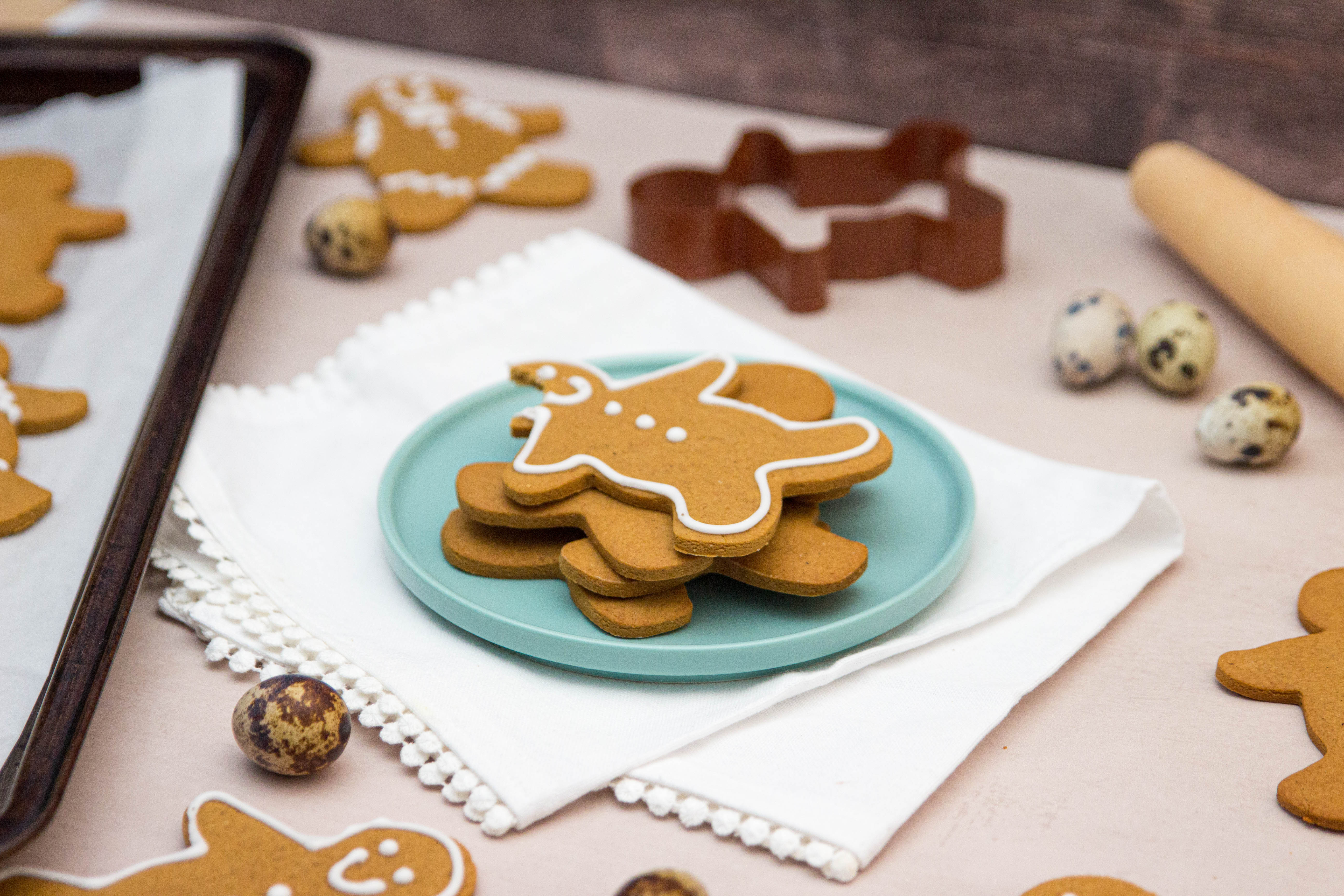 stack of gingerbread men cookies with icing