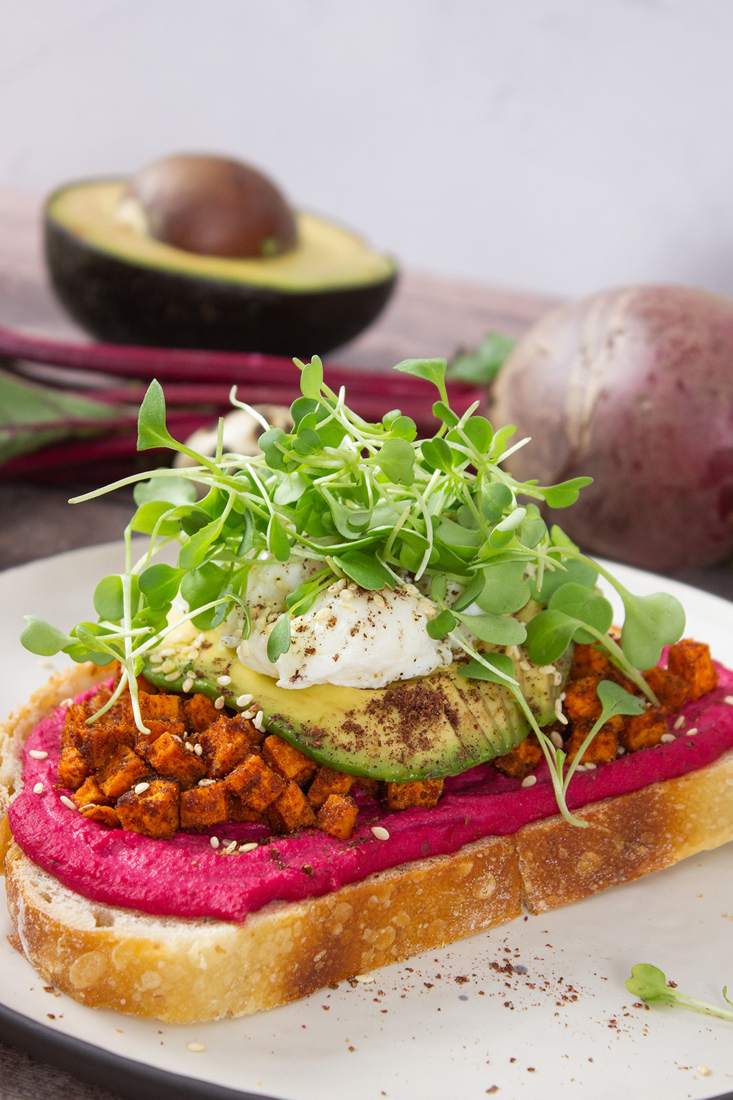 Beet Hummus Toast with Poached Quail Eggs